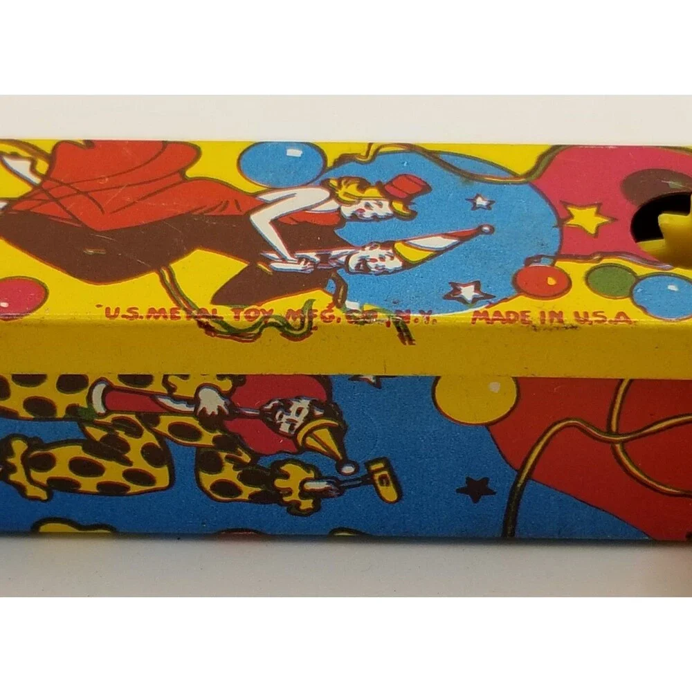 vintage tin lithograph ratchet style US Metal Toy Co noisemaker party theme